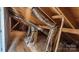 This attic features exposed insulation, ductwork, and wooden beams at 1123 Fieldstone Rd, Mooresville, NC 28115