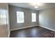 This bedroom features a ceiling light fixture and two windows, creating a bright and inviting space at 1123 Fieldstone Rd, Mooresville, NC 28115