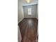 Neutral bedroom featuring wood floors, a window, and an interior door at 1123 Fieldstone Rd, Mooresville, NC 28115
