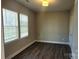 Bright bedroom with hardwood floors and two large windows at 1123 Fieldstone Rd, Mooresville, NC 28115