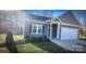 Charming home featuring modern siding, well-manicured landscaping, and an attached garage at 1123 Fieldstone Rd, Mooresville, NC 28115