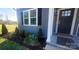 Inviting front entrance with dark blue door and stylish landscaping at 1123 Fieldstone Rd, Mooresville, NC 28115