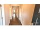 Long hallway featuring wood floors and neutral paint at 1123 Fieldstone Rd, Mooresville, NC 28115