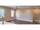 Bright living room with modern ceiling fan and window at 1123 Fieldstone Rd, Mooresville, NC 28115