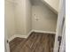 Storage closet under the stairs with wire shelf and utility hookups at 1123 Fieldstone Rd, Mooresville, NC 28115