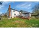 Expansive backyard with lush lawn, a deck and mature trees at 113 Windsong Ct, Gastonia, NC 28056