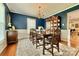 Formal dining room featuring elegant blue walls, hardwood floors and chandelier at 113 Windsong Ct, Gastonia, NC 28056