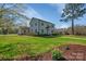 Beautifully landscaped home with lush green lawn and flowering trees at 113 Windsong Ct, Gastonia, NC 28056