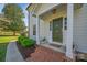Charming front door with brick steps, manicured landscaping, and a welcoming entrance at 113 Windsong Ct, Gastonia, NC 28056