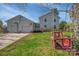 Home featuring a two-car garage with a basketball hoop and swing at 113 Windsong Ct, Gastonia, NC 28056