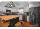 Kitchen featuring stainless steel appliances, white cabinets, hardwood floors, and a butcher block island at 113 Windsong Ct, Gastonia, NC 28056