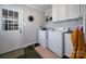 Laundry room with washer, dryer, and storage space at 113 Windsong Ct, Gastonia, NC 28056