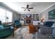Cozy living room with a fireplace, built-in bookshelves, and comfortable seating arrangement at 113 Windsong Ct, Gastonia, NC 28056