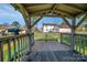 Interior view of the backyard playhouse featuring telescope, seating, and a view of the back of the property at 113 Windsong Ct, Gastonia, NC 28056