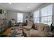Bright playroom featuring large windows, playful decor, and comfortable seating at 113 Windsong Ct, Gastonia, NC 28056