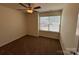 Carpeted bedroom with ceiling fan and large window that brings in lots of natural light at 13615 Browhill Ln, Charlotte, NC 28278