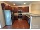 Modern kitchen features stainless steel appliances, granite countertops, and plenty of cabinet space at 13615 Browhill Ln, Charlotte, NC 28278