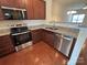 Beautiful kitchen features stainless steel appliances, granite counters, and ample cabinet storage at 13615 Browhill Ln, Charlotte, NC 28278