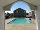 Community pool with ample seating, surrounded by well-maintained grounds at 13615 Browhill Ln, Charlotte, NC 28278