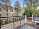 View from the deck of the backyard featuring a well-manicured lawn and a view of the neighbor's house at 1409 Kenilworth Ave, Charlotte, NC 28203