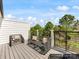 Spacious balcony with stylish wicker seating and great views of the surrounding greenery at 1409 Kenilworth Ave, Charlotte, NC 28203