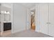 Bedroom featuring carpet, ensuite bathroom view, and double door closet at 1409 Kenilworth Ave, Charlotte, NC 28203