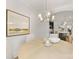 Cozy dining room featuring a round wood table, modern chandelier, and view of the kitchen at 1409 Kenilworth Ave, Charlotte, NC 28203