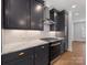 Close up on kitchen range, countertops and cabinets at 1409 Kenilworth Ave, Charlotte, NC 28203