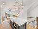Kitchen island with a white farmhouse sink, stainless steel dishwasher, and seating at 1409 Kenilworth Ave, Charlotte, NC 28203