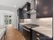 Close up on kitchen range, countertops and cabinets at 1409 Kenilworth Ave, Charlotte, NC 28203