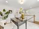 Bright office with black writing desk, comfortable chair, and a view into the upstairs hallway at 1409 Kenilworth Ave, Charlotte, NC 28203