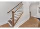 Stylish stairway with wood railings and white spindles at 1409 Kenilworth Ave, Charlotte, NC 28203
