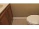 Bathroom with neutral tiling featuring a toilet and a wood-stained vanity at 1629 & 1631 Harris Rd # 6&7, Fort Mill, SC 29708