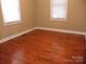 Bedroom featuring hardwood floors and natural light from two windows at 1629 & 1631 Harris Rd # 6&7, Fort Mill, SC 29708