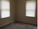 Bright bedroom with two windows allowing natural light to illuminate the room at 1629 & 1631 Harris Rd # 6&7, Fort Mill, SC 29708