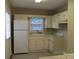 Kitchen featuring white cabinets, appliances, and natural light from a window at 1629 & 1631 Harris Rd # 6&7, Fort Mill, SC 29708