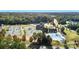 Aerial view of the community's tennis courts, pool, clubhouse, and scenic landscaping at 19011 Dry Narrows Way, Charlotte, NC 28278