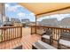 Outdoor deck area covered with a shade, featuring outdoor seating and views of the backyard at 19011 Dry Narrows Way, Charlotte, NC 28278