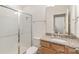 Bathroom featuring a glass door shower, granite countertops, wood cabinets and ceramic tile floor at 19011 Dry Narrows Way, Charlotte, NC 28278