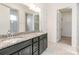 Bright bathroom with a granite countertop vanity, tiled floor, walk-in closet, and glass shower at 19011 Dry Narrows Way, Charlotte, NC 28278