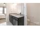 Bathroom featuring double sinks, dark wood cabinets, and granite countertop for a luxurious feel at 19011 Dry Narrows Way, Charlotte, NC 28278