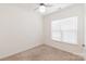 Bedroom with carpet floors, ceiling fan and a bright window at 19011 Dry Narrows Way, Charlotte, NC 28278