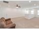 Bright bonus room with neutral carpet, ceiling fan, and lots of natural light from the windows at 19011 Dry Narrows Way, Charlotte, NC 28278