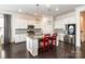Modern kitchen with granite countertops, stainless steel appliances, and island seating at 19011 Dry Narrows Way, Charlotte, NC 28278