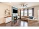 Inviting living room with fireplace, TV, and dark wood floors at 19011 Dry Narrows Way, Charlotte, NC 28278