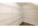 Spacious pantry equipped with multiple levels of wire shelving, maximizing storage for any homeowner at 19011 Dry Narrows Way, Charlotte, NC 28278