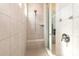 Beautiful tiled shower with a built-in seat and shower head at 19011 Dry Narrows Way, Charlotte, NC 28278