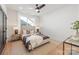 Cozy bedroom with a ceiling fan, large window, neutral décor, and a stylish rug at 2013 South St, Charlotte, NC 28208