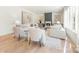 Bright living room with hardwood floors, fireplace, large windows, and neutral color palette at 2013 South St, Charlotte, NC 28208