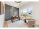 Stylish home office features hardwood floors, a large window, and a decorative accent wall at 2013 South St, Charlotte, NC 28208